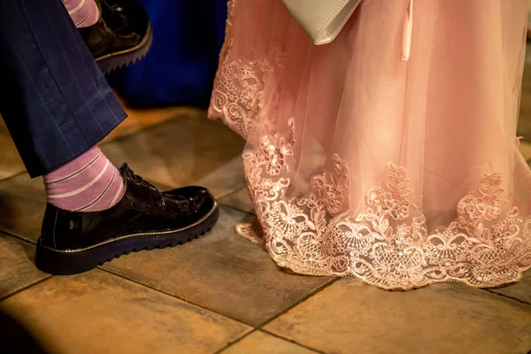 Bride and groom legs on floor — Stock Photo, Image