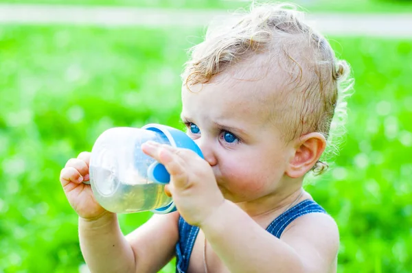 Little Baby Boy Sitting Grass Park Drinking Bottle Stock Picture
