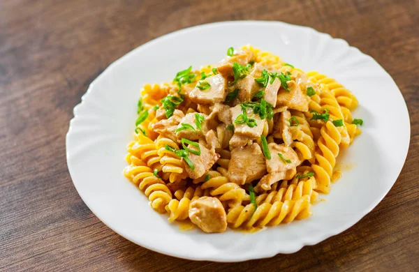 Sliced Fried Chicken Fillet Creamy Sauce Fusilli Pasta White Plate — Stock Photo, Image