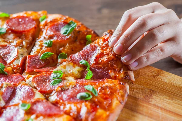 Woman Hand Takes Slice Pepperoni Pizza Mozzarella Cheese Salami Ντομάτες — Φωτογραφία Αρχείου