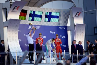Soçi, Rusya - 30 Nisan 2017: İlk üç bitirenler Valtteri Bottas Mercedes, Sebastian Vettel ve Kimi Raikkonen Ferrari podyum üzerinde Grand Prix Rusya'nın Soçi, sırasında kutlamak.