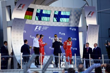 Soçi, Rusya - 30 Nisan 2017: İlk üç bitirenler Valtteri Bottas Mercedes, Sebastian Vettel ve Kimi Raikkonen Ferrari podyum üzerinde Grand Prix Rusya'nın Soçi, sırasında kutlamak.