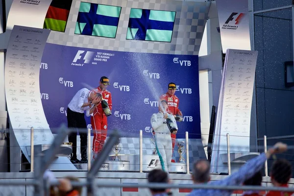 Soçi, Rusya - 30 Nisan 2017: İlk üç bitirenler Valtteri Bottas Mercedes, Sebastian Vettel ve Kimi Raikkonen Ferrari podyum üzerinde Grand Prix Rusya'nın Soçi, sırasında kutlamak.