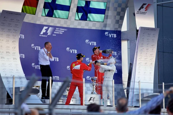 Soçi, Rusya - 30 Nisan 2017: İlk üç bitirenler Valtteri Bottas Mercedes, Sebastian Vettel ve Kimi Raikkonen Ferrari podyum üzerinde Grand Prix Rusya'nın Soçi, sırasında kutlamak.