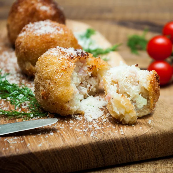 Potatoes croquets, tomatoes and dill. — Stock Photo, Image