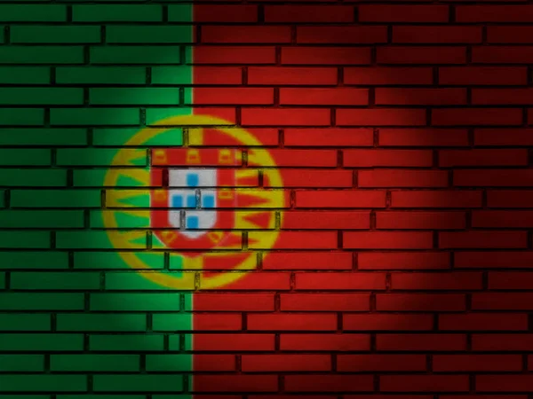 Кирпичная стена с флагом Португалии — стоковое фото