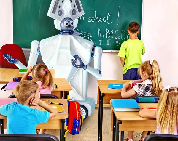 Teacher robot with school children in school class near blackboard.