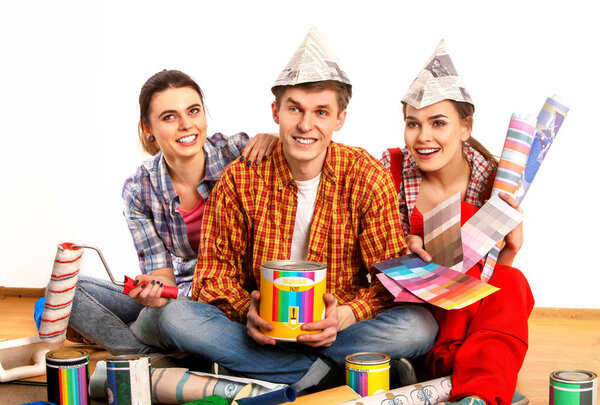 Repair group people building home using paint roller tools.