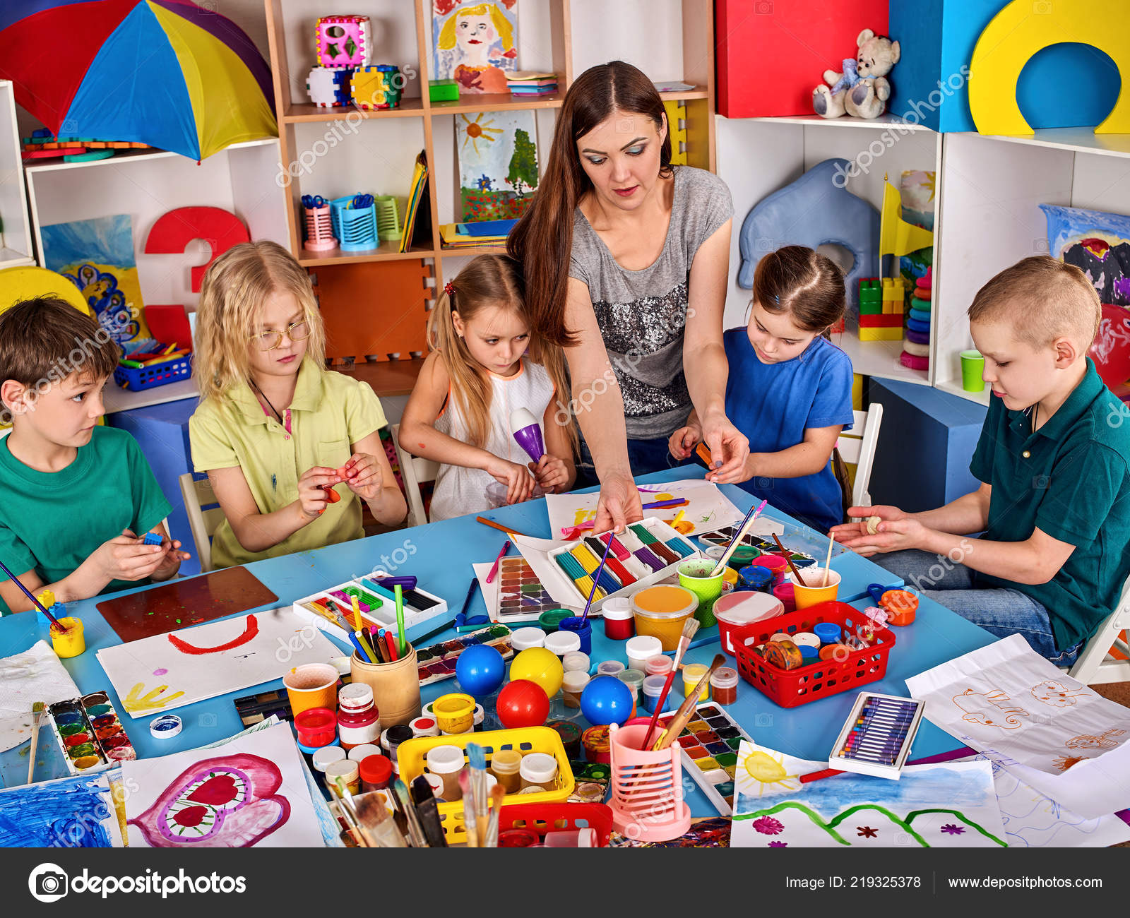 Plasticine modeling clay in children class. Clay projects teacher school.  Stock Photo by ©poznyakov 219325378