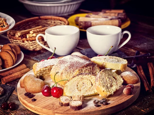 Sand nut chocolate cookies and rolled biscuit on board — Stock Photo, Image