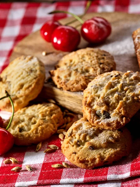 Oatmeal cookies snack and cherry breakfast close up