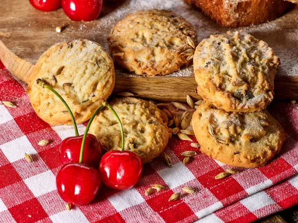Oatmeal cookies snack and cherry breakfast close up — Stock Photo, Image