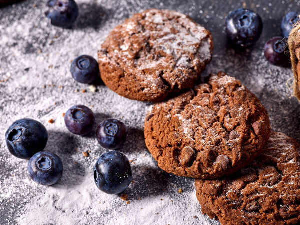 Chocolate chip cookies tied with string. Serving food on slate