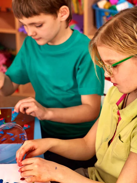 Children model from plasticine in school craft lesson — Stock Photo, Image