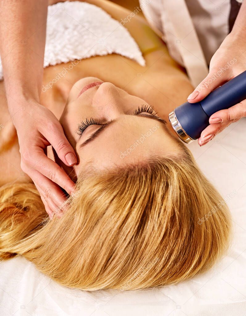 Ultrasound woman massage and therapy in cosmetology in spa salon
