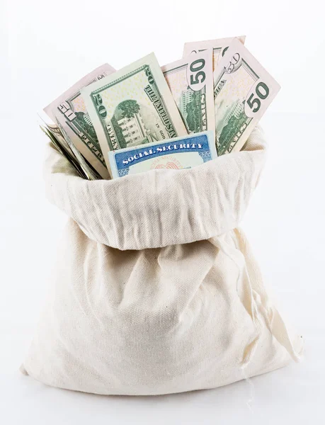 Many US dollar bills or notes in money bag with social security card — Stock Photo, Image