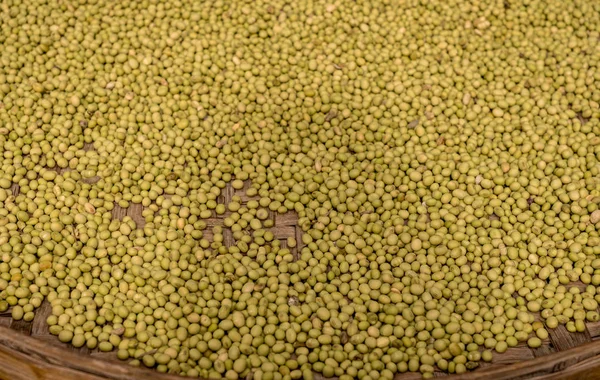 Green split peas drying inside Tulou in Fujian Province — Stock Photo, Image