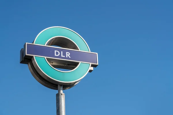 Docklands Light Railway sign against blue sky — Stock Photo, Image