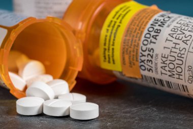 Macro of oxycodone opioid tablet bottle clipart