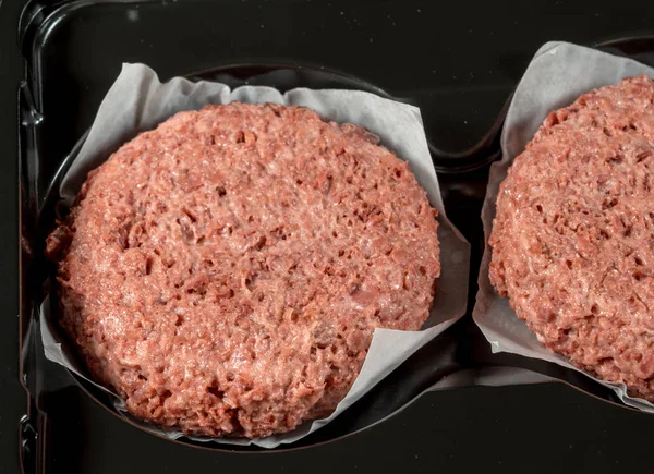 Close up of plant based burger patties before cooking — Stock Photo, Image