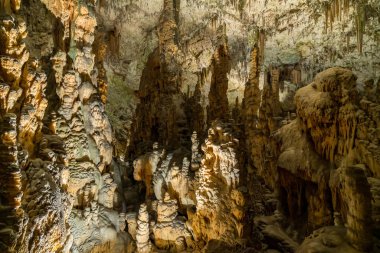 Strange rock formations underground in cave system clipart