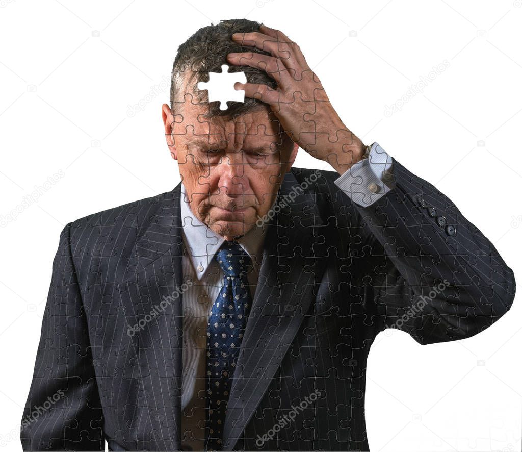 Front view of senior caucasian man worried about memory loss and dementia