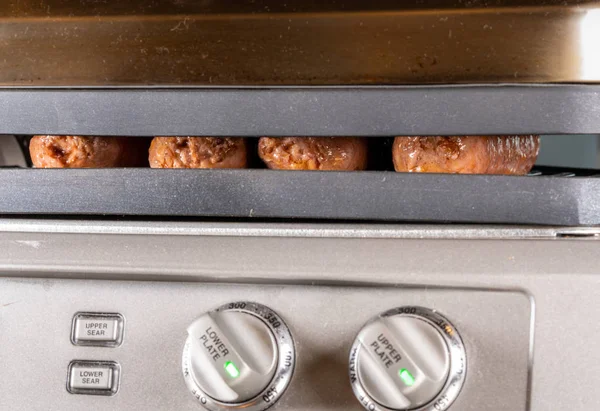 Plant based vegetarian sausages being grilled on griddle — Stock Photo, Image