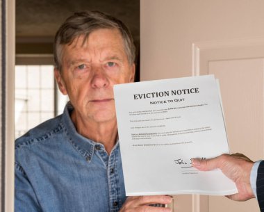 Man in suit giving eviction notice to renter or tenant of home clipart