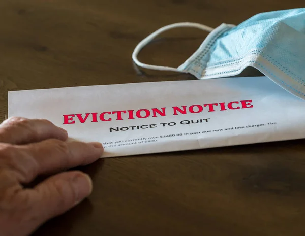 Official legal eviction order or notice to renter or tenant of home with face mask — Stock Photo, Image