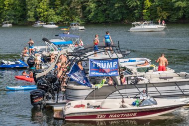 Trump supporters party on Cheat Lake near Morgantown on Labor Day 2020 clipart