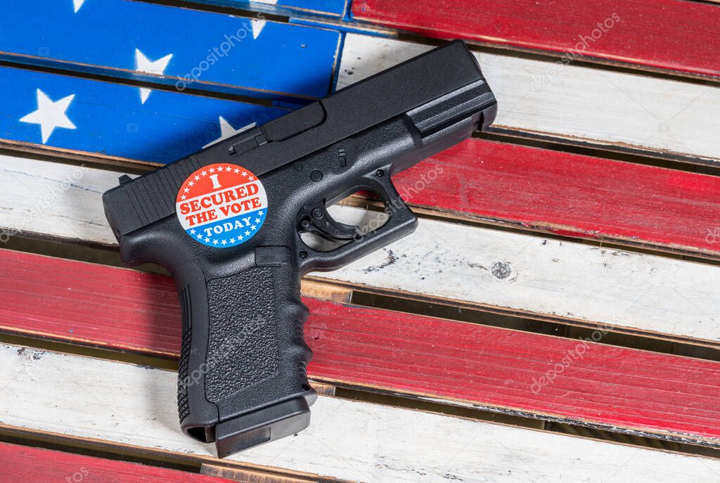 Concept of protecting against voter fraud with firearm and voting sticker