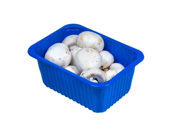 Champignons in plastic packaging isolated on white. — Stock Photo, Image