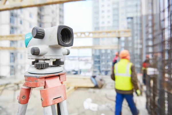 Construction and building surveying. Surveyor level on building area Stock Photo