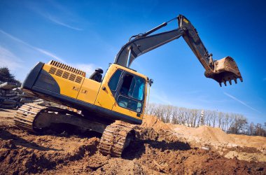 Ekskavatör yükleyici makine Hafriyat, sandpit inşaat sitesinde açık havada çalışmak