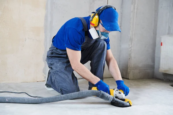 Concrete floor surface grinding by angle grinder machine — Stock Photo, Image