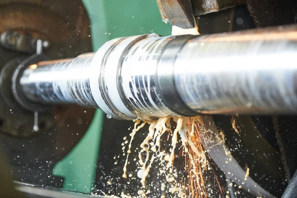 Metal industry. finishing shaft surface on grinder machine — Stock Photo, Image