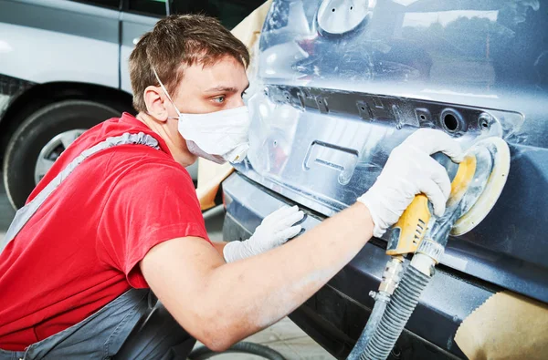 Auto repairman grinding autobody — Stock Photo, Image