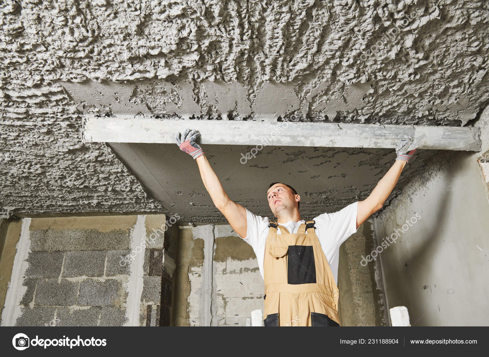 Plasterer Smoothing Plaster Mortar On Ceiling With Screeder