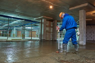 concrete floor construction. Worker with line clipart