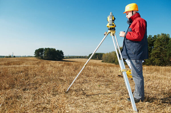 surveyor worker with theodolite