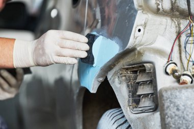 auto repairman plastering autobody bonnet clipart