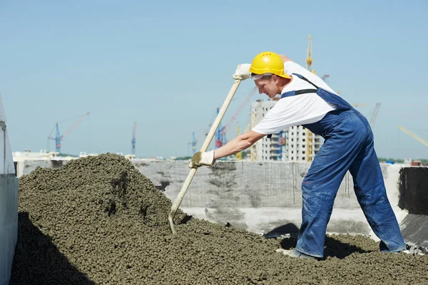 Manual worker leveling claydite mortar with float lute at roof construction works of residential building — Stock Image Manual Worker Leveling Claydite Mortar Float Lute Roof Construction Works Royalty Free Stock Photos