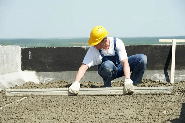 Roof construction. worker roofer leveling with float lute — Stock Image Roof construction. worker roofer leveling with float lute Royalty Free Stock Images