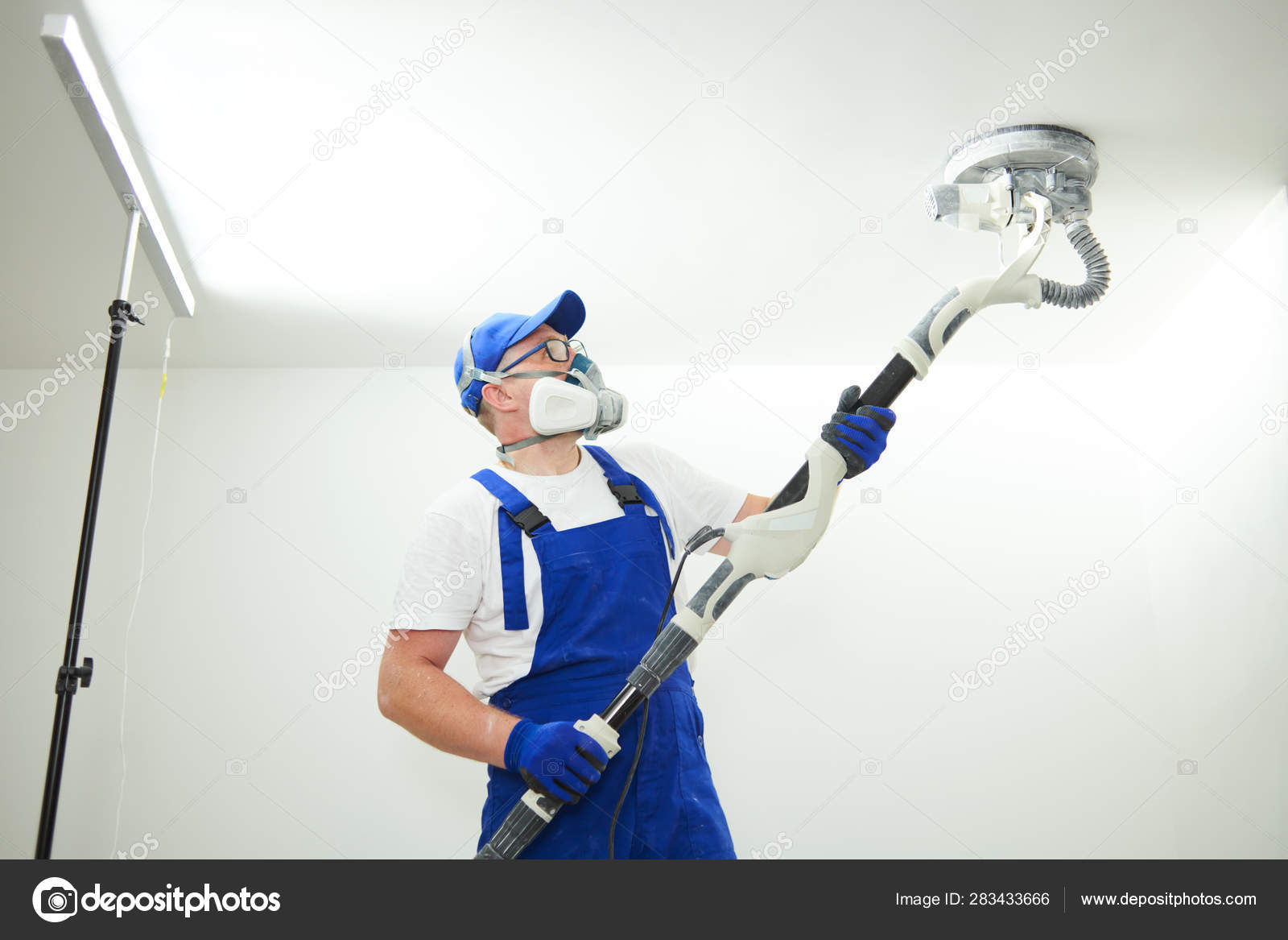 Painter Work With Ceiling Polishing And Sanding The Surface