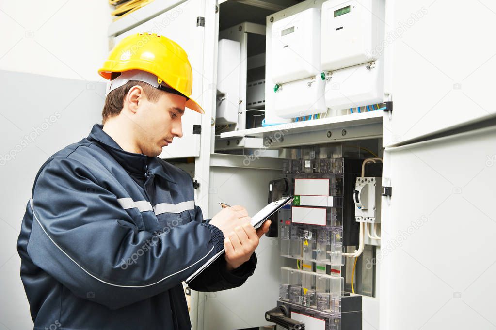 electrician engineer worker inspecting electrical data