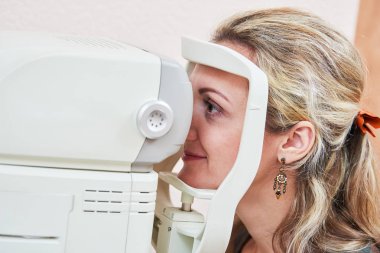 ophthalmology. eyesight check of adult female woman clipart