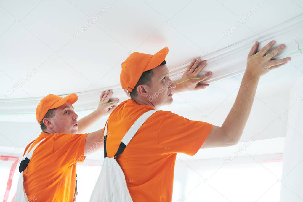 installing decorative ceiling molding. home repair and decoration