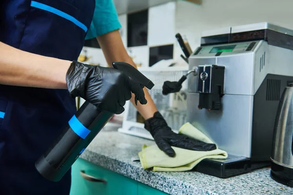 Cleaning service. wiping office coffee machine — Stock Photo, Image