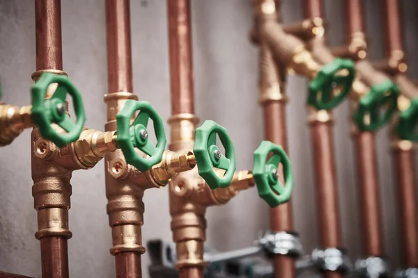 Plumbing service. copper pipeline of in boiler room. valves in row — Stock Photo, Image