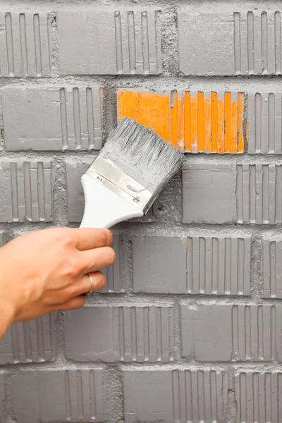 Human Hand Painting Last Orange Brick Wall Grey Color — Stock Photo, Image